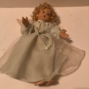 Precious little choir girl/ angel in green dress that can be hung on top of tree